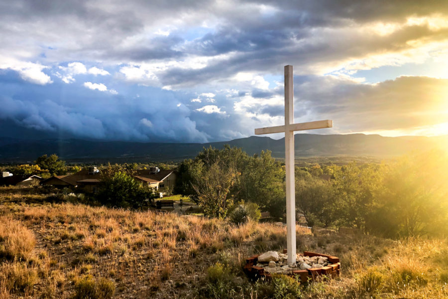 Rainbow Acres is a residential Christian Community for adults with developmental disabilities. On the 50-acres ranch campus, a white wooden cross stands on top of Glory Hill.